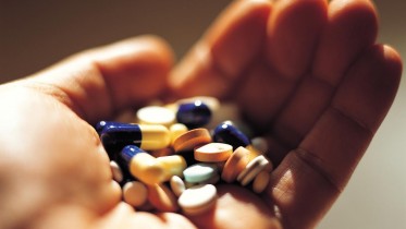 Hand-Holding-Medication-Prescription-Pills-Capsules