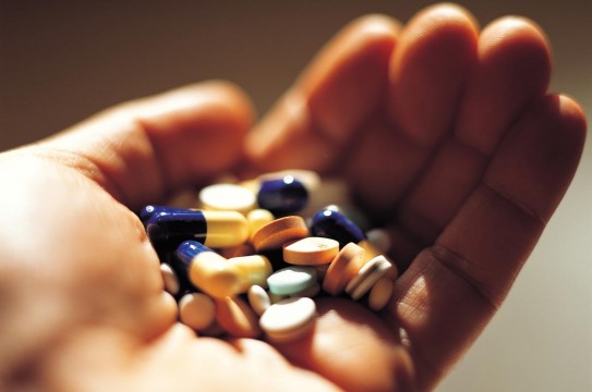 Hand-Holding-Medication-Prescription-Pills-Capsules